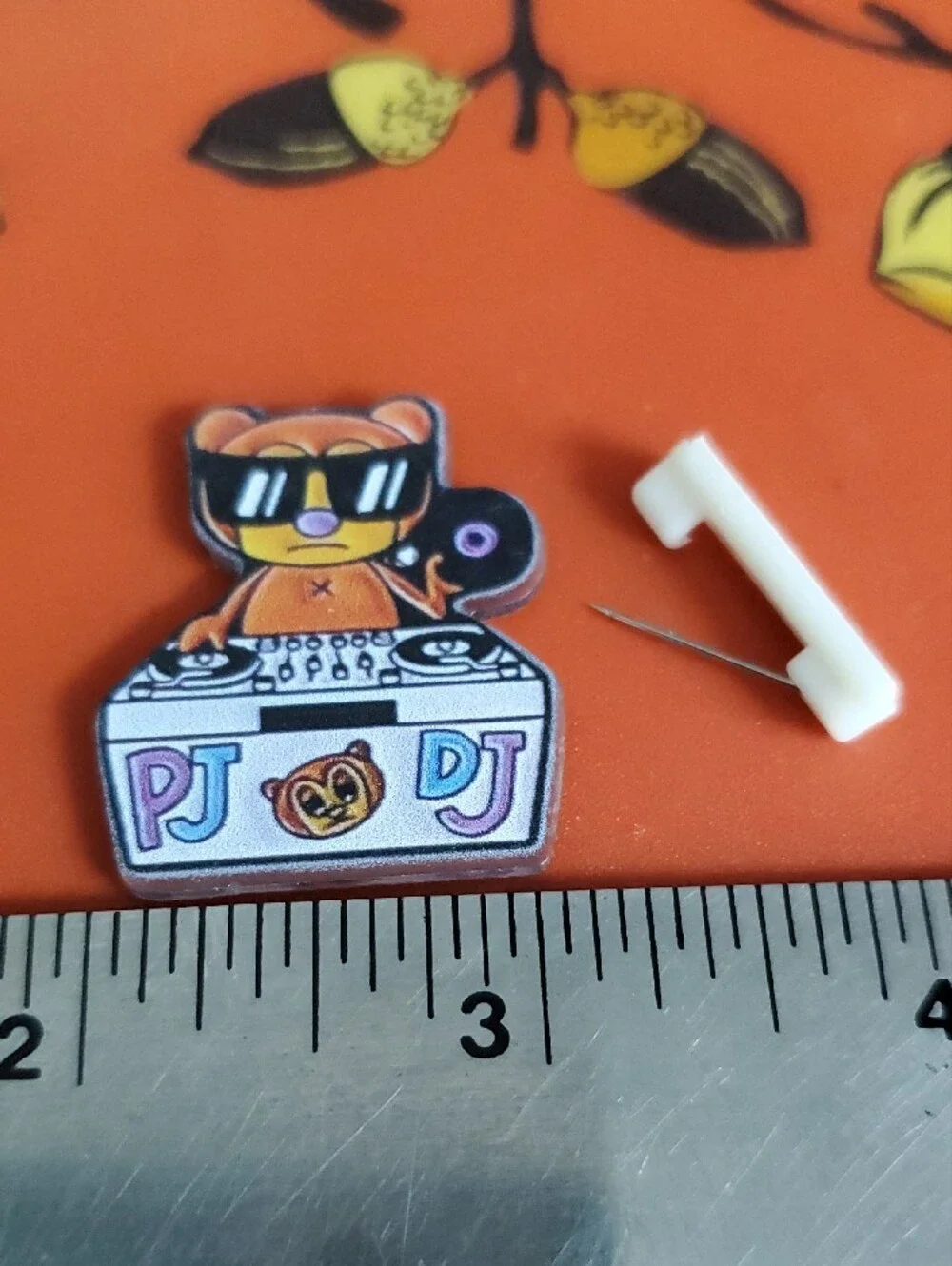 PJ Berri DJ Bear Acrylic Pin in Orange, Black & White